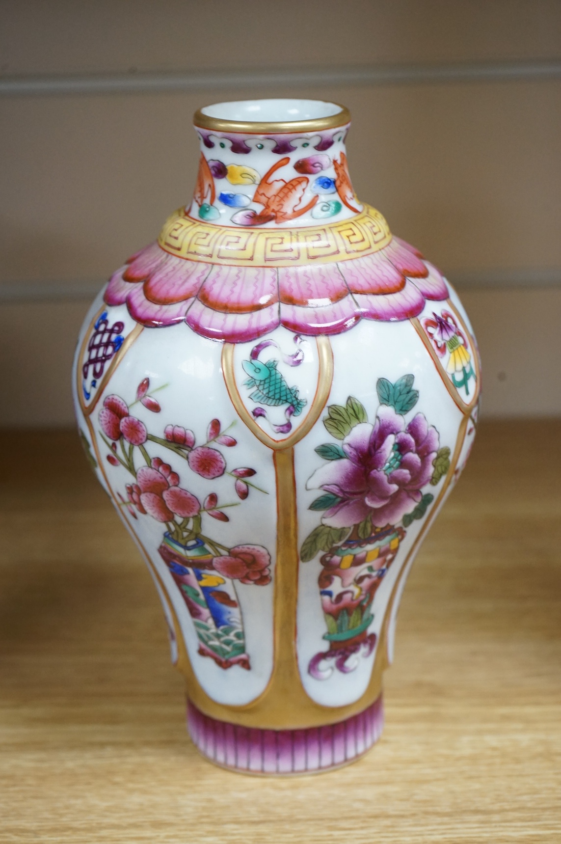 A Chinese famille rose vase enamelled with flowers, 20cm high. Condition - good